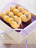 Heart-shaped biscuits decorated with lavender flowers and chocolate glaze