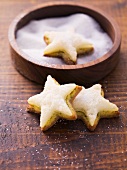 Star-shaped biscuits topped with marzipan and pistachios