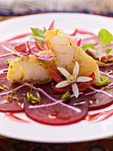 Battered cod on beetroot carpaccio