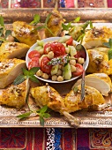 Fried chicken and chickpeas salad with cucumber and tomatoes