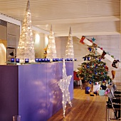 Creative Christmas decorations in open-plan designer kitchen of loft apartment