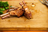 Fried lamb chops on a chopping board