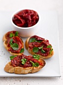 Crostini topped with dried peppers