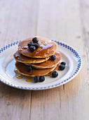Stack of Blueberry Pancakes with Syrup