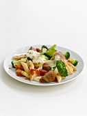 Penne pasta bake with sausages, broccoli and cheese