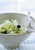 White cabbage salad with black olives