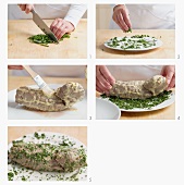 Steamed veal fillet being rolled in herbs