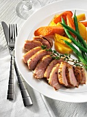 Roast duck breast with vegetables