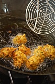 Deep-fried fish dumplings in a pan (India)