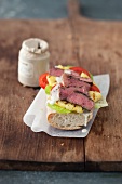 Rump steak, pineapple and lime mayonnaise on a baguette