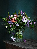 Bouquet of sweet peas on wooden table