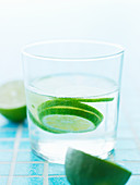 Slices of lime in a glass of water