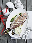 A whole red snapper with onion mayonnaise