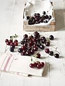 Cherries, a tea towel and a wooden crate