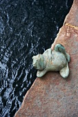 Frog Statue by a Garden Pond