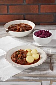 Beef ragout with beer from Salzburg with potato dumplings and red cabbage