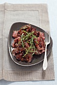 Beef carpaccio with dried tomatoes and a cranberry dressing