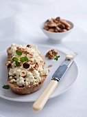 Bread topped with ricotta and roasted nuts