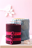 Candle holders with knitted covers
