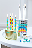 Original candle holders made form tin cans and coloured rubber bands