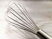 Metal Whisk on a Steel Surface