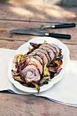 Veal roulade with an onion and celery medley