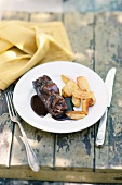 Ox roulade with red wine sauce and baked potatoes