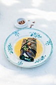 Sea bass with basil puree wrapped in aubergine