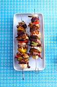 Beef kebabs with prawns and vegetables