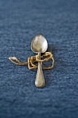 A piece of string tied around a spoon