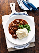 Braised beef with peas and mashed potatoes