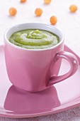 A cup of cream of broccoli soup