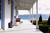 Wooden house with veranda and view of mountain landscape