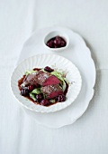 Saddle of venison with pointed cabbage and preserved cherries
