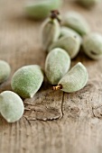 Fresh almonds on a wooden surface