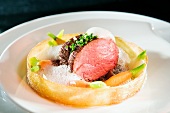 Styria beef with milk foam and baby carrots