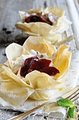 Puff pastry dishes filled with plums and plum cream