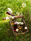 Italian herbal lemonade in a wire bottle basket on the grass