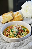 Pearl barley soup with bacon and pine nuts