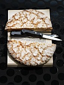 Potato bread and a knife on a book