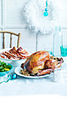 Roast turkey with dried figs and smoked ham with a quince glaze