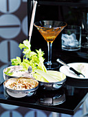 A Roquefort dip with caramelised onions and walnuts, celery and a cocktail