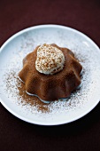 Chocolate pudding with cream and cocoa powder