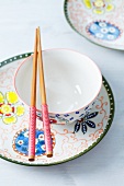 Oriental crockery with chopsticks