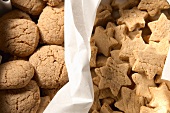 Nut biscuits and cinnamon and almond stars in a biscuit tin