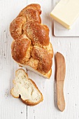 Challah (braided yeast bread) with butter