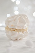 White meringue cookies with coconut cream