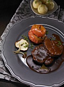 Sauerbraten made from leg of venison with baked apple, dumplings and sauce
