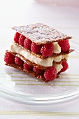 Layer dessert with brittle and raspberries