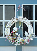 Easter wreath with spring flowers, bunny and decorative eggs